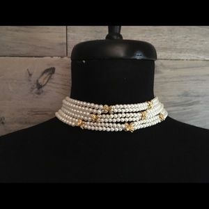 6 strand pearl necklace with tiny gold butterflies